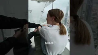 Attempting the world's scariest glass slide!