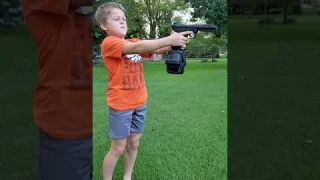 Kid shooting airsoft gun